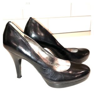 Black leather pumps